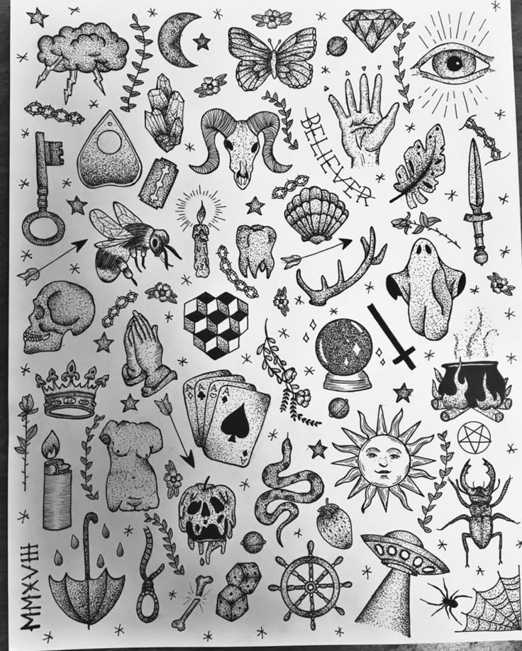 a sheet of paper that has various tattoos on it and an eye in the middle