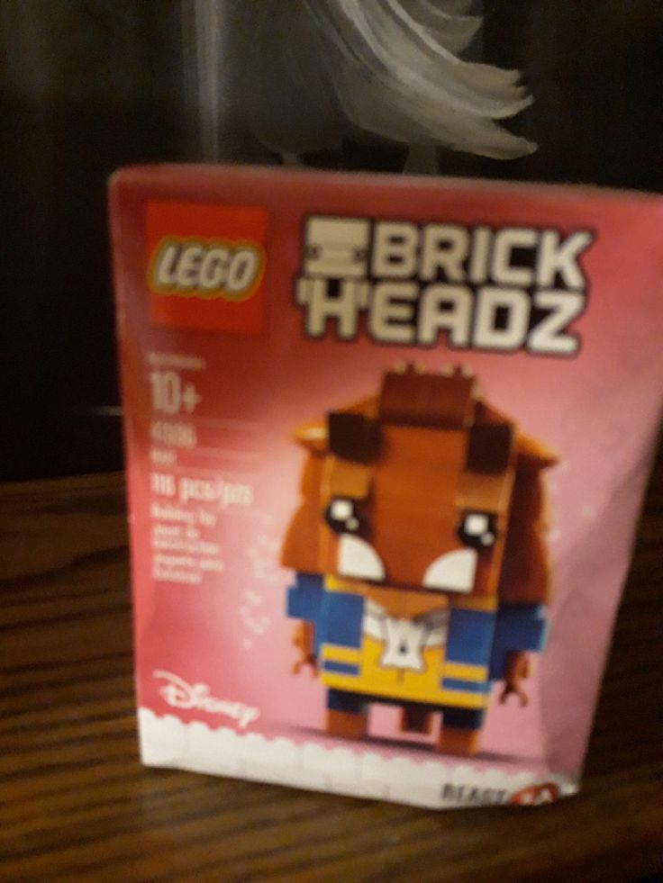 the lego brick headz box is sitting on a table