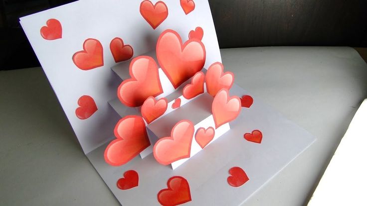 a card with hearts on it sitting on a table