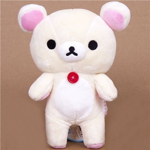 a white teddy bear with black eyes and pink ears, standing on a brown background