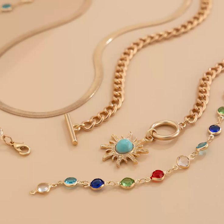 This stunning Regina Layered Lariat Necklace Set brings a playful yet elegant touch to any ensemble. Featuring a multi-color beaded design, this layered necklace set is perfect for adding a splash of color to your outfits. The lariat drop design adds a chic and sophisticated look, making it ideal for both casual wear and special occasions. The set includes two necklaces, each offering a different length for an effortlessly layered appearance. Details: Material: Gold-plated brass with colorful beads Set weight: 42.4g (1.49oz) Short necklace length: 37cm + 7cm extension (14.5in + 2.7in) Long necklace length: 70cm (27.5in) Pendant size: 2.5cm x 0.98in Chain thickness: 0.6cm (0.23in) Eye-catching multi-color bead accents Layered lariat drop design for a trendy and unique look Missy Jewelry Nec Elegant Multicolor Lariat Jewelry, Summer Multicolor Clavicle Chain Jewelry, Multicolor Lariat Necklace With Adjustable Chain, Multicolor Delicate Chain Jewelry For Party, Trendy Metal Lariat Jewelry, Trendy Metal Lariat Necklace, Trendy Multicolor Metal Necklaces, Colorful Jewelry With Adjustable Chain, Multi-strand Summer Jewelry For Party