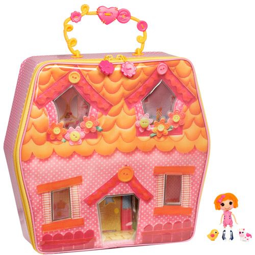 a toy doll house with two dolls in the front and one on the back side