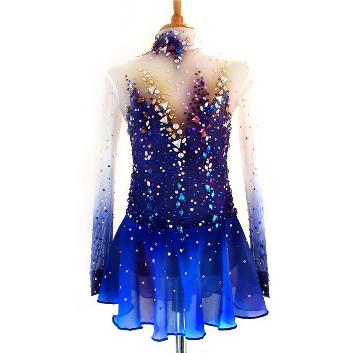 a blue and white figure skating dress on a mannequin headdress with sequins