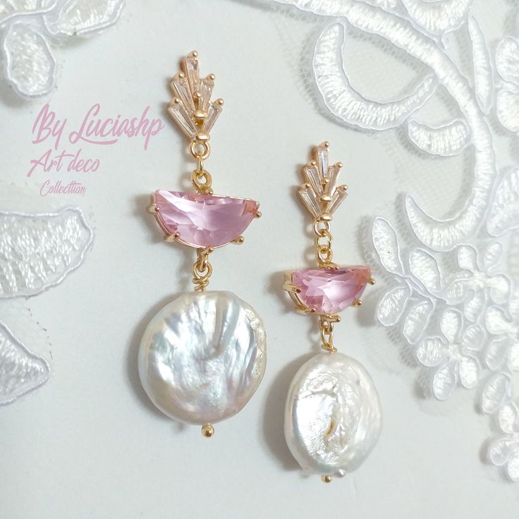 Looking for the perfect statement earrings for your wedding day? These Pearl Bridal Earrings with Pink Art Deco details are perfect for the boho bride who wants to add a touch of elegance to her look. With natural pearls and a long dangle design, these earrings are sure to make a statement on your big day.     They're also a great gift for bridesmaids or for any special occasion. MATERIALS: Brass gold plated 14k                        Pink Crystal faceted                        Clear Zircon AAA Elegant Handmade Crystal Earrings For Wedding, Elegant Handmade Crystal Wedding Earrings, Pink Round Chandelier Earrings For Wedding, Pink Chandelier Earrings For Wedding, Elegant Pink Round Chandelier Earrings, Pink Handmade Clip-on Earrings For Wedding, Handmade Pink Clip-on Earrings For Wedding, Handmade Drop Crystal Earrings For Wedding, Handmade Pink Crystal Earrings For Wedding