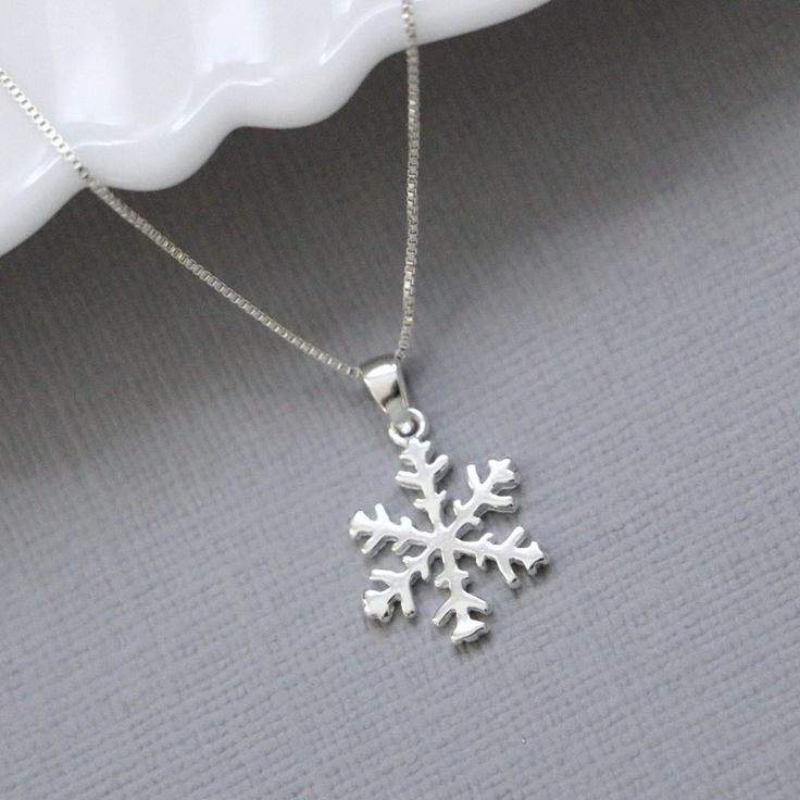 Sterling silver snowflake pendant on fine sterling silver necklace chain, bridesmaid gift OTHER SNOWFLAKE JEWELRY IN THE STORE: https://www.etsy.com/shop/alexandreasjewels/search?search_query=snowflake Snowflake size: 14mm Also available at 18mm in listing below: https://www.etsy.com/listing/205447671/snowflake-necklace-sterling-silver ADD-ON CHARMS: https://www.etsy.com/listing/205430600/add-a-charm-personalize-your-jewelry?ref=listing-shop-header-0 COMES CAREFULLY AND BEAUTIFULLY GIFT PACKAGED Silver Snowflake Necklace For Anniversary, Silver Jewelry Christmas Gift For Her, Sterling Silver Snowflake Jewelry For Anniversary, Silver Snowflake Necklace For Holiday, Silver Necklace For Christmas Gift For Her, Christmas Jewelry Gift For Her, Snowflake White Gold Jewelry Gift, Sterling Silver Snowflake Necklace In White Gold, White Gold Snowflake Jewelry Gift