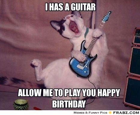 a cat playing with a guitar and captioning that it's too loud