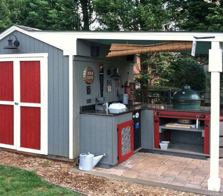 an outdoor kitchen is built into the side of a shed