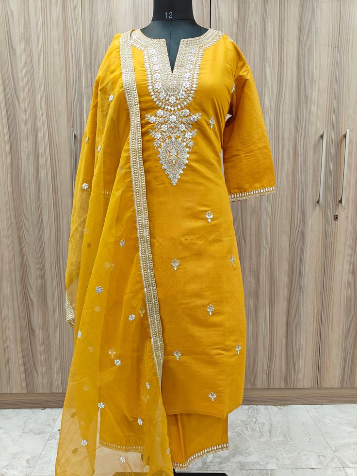 Indian Wedding Wear Salwar Kameez / Indian Ethnic Dress / Plus Size Silk Kurta Dress Traditional Indian Wear / Salwar Kameez Dupatta / Kurti Palazzo Set / Party Wear/ Silk Kurta Set Item Details Mustard Yellow embroidered Kurta Trousers With dupatta KURTA Neck : Round Neck Sleeves : 3/4 Sleeves Fabric : Silk Blend Work Type : Embroidered Sequinned Length : 46" PANT Pant style : Embroided trouser with elastic waist Band Fabric : Silk Blend length : 37" DUPATTA Fabric : Organza Length : 2meter Was Straight Kurta With Gota Work In Dola Silk, Transitional Semi-stitched Kurta With Gota Work, Bollywood Style Kurta With Gota Work For Transitional Season, Yellow Art Silk Kurta With Gota Work, Transitional Yellow Churidar With Zari Work, Transitional Straight Kurta Dress With Gota Work, Chanderi Churidar With Gota Work For Transitional Season, Straight Kurta With Gota Work For Eid, Festive Dola Silk Kurta With Gota Work