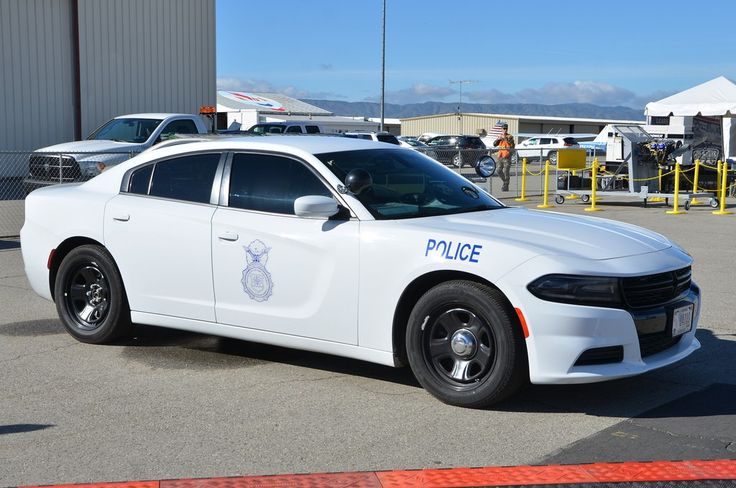 a police car parked in front of a building