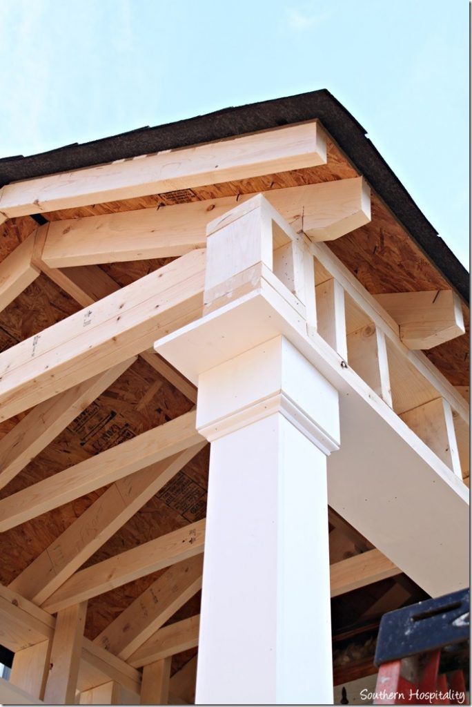 a close up view of the top of a building with wood framing on it's sides