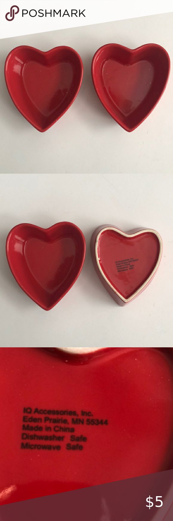 four red heart shaped plates sitting on top of each other