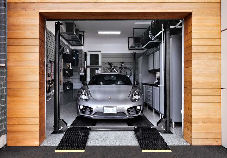 a car is parked in the garage with it's door open to let people know where they are going