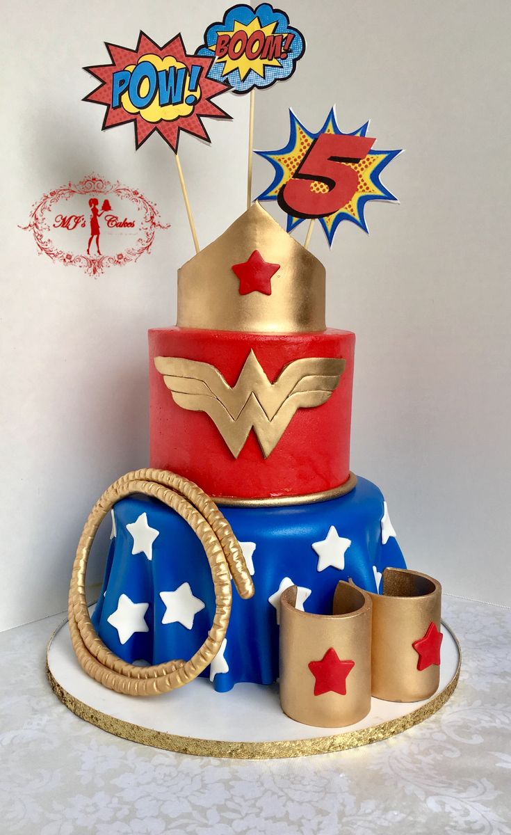 the cake is decorated with red, white and blue icing as well as gold decorations