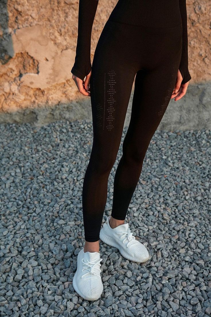 Why We Love It： Our Buttery Seamless Legging features supportive ribbed waistband. It's created with the best in class nylon and spandex. The soft skin feel and incredible stretchiness is just different from any traditional seamless pieces you've ever had. Eyelet detailing adds an understated sexiness. Pair it with your fave WISKII top. Fit & Features： Eyelet detailing Supportive ribbed waist High rise & hits at the ankle Color: Black Size: S, M, L Model 1 is 5’7”, with a 26” waist & 35.4” hips Stretch Seamless Leggings, Stretch Seamless Leggings Made Of Elastane, Seamless Nylon Leggings, Seamless Stretch Elastane Yoga Pants, High Stretch Seamless Training Tights, High Stretch Seamless Tights For Training, High Stretch Seamless Fabric Tights For Training, Breathable High Stretch Seamless Tights, Functional Seamless Tight Tights