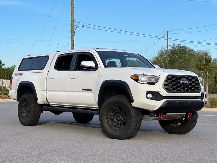 a white truck parked in a parking lot