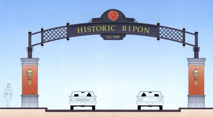 two cars are parked under a sign for historic ripon