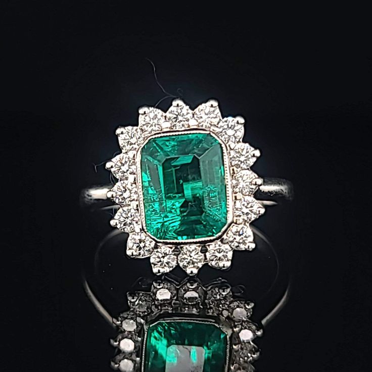 Gorgeous 14K WHITE GOLD ring Gem GREEN Colombia emerald. Center set Gem lab flux growth green Colombia emerald in emerald shape weight 1.75ct. size 8.5x7mm very nice rich vivid green color nice luster, lively ,nice cut,Sparkly emerald. side set 16 natural round diamonds total weight 0.64ct. H-VS Ring size 7.5 Retail Value $6,500 net Appraisal available White Gold Cluster Ring With Emerald Cut Gemstone, Emerald Cut Gemstones With Halo Setting, White Gold Gemstone With Emerald Brilliant Cut, Emerald Cut Green Gemstone Cluster Ring, Formal Emerald Gemstones With Halo Setting, Green Brilliant Cut Ring, Emerald Cluster Ring With Brilliant Cut, Green Emerald Cut Gemstone Cluster Ring, Dazzling Green Emerald Cut Emerald Ring