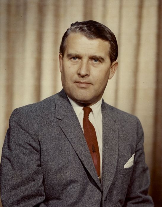 an old photo of a man in a suit and tie