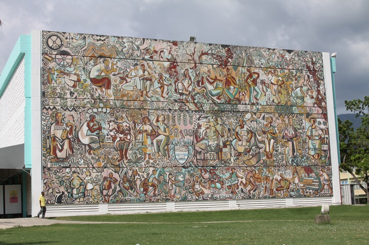 a large mural on the side of a building with people and animals painted on it