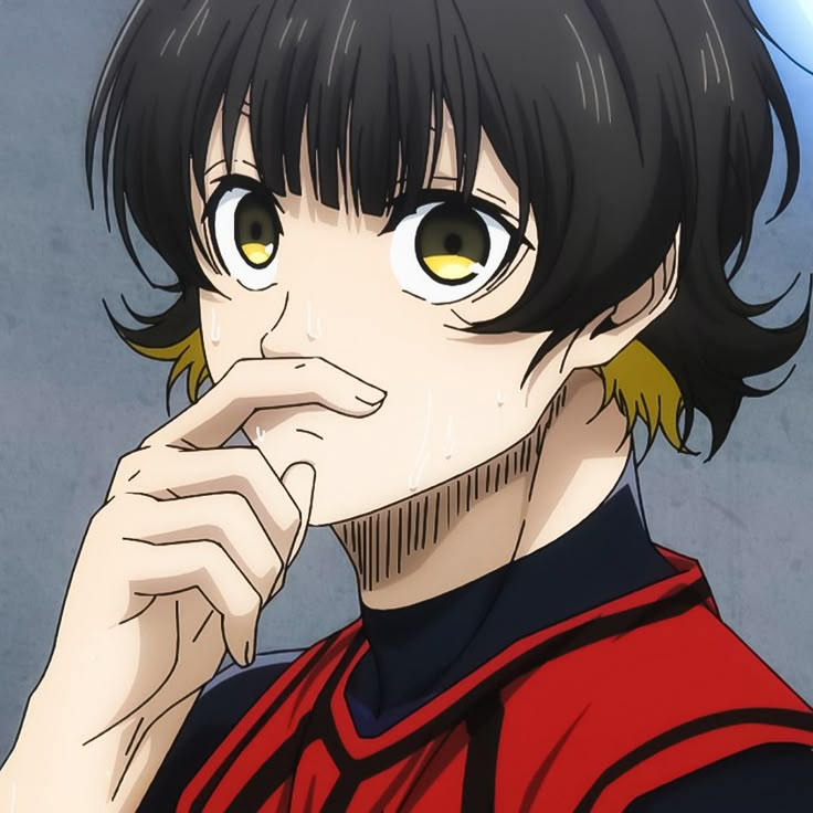 a man with black hair and yellow eyes is looking at the camera while holding his finger to his mouth