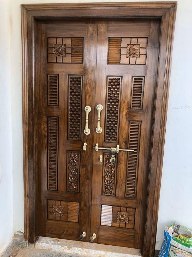 a wooden door with decorative carvings on it