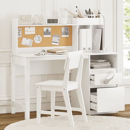 a white desk and chair in a room