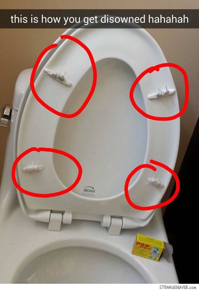 a toilet with four red circles on it