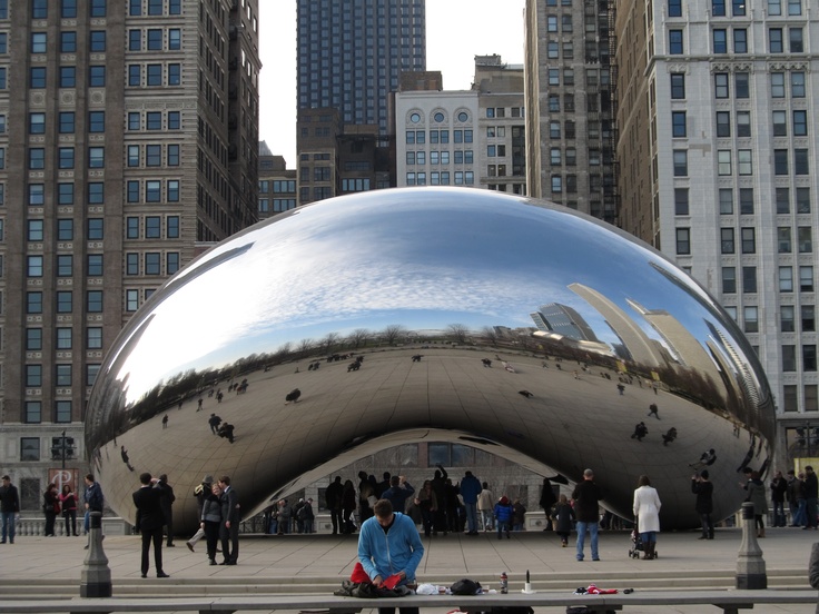 a large metal object sitting in the middle of a city