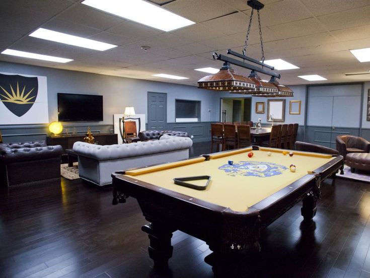 a pool table in the middle of a living room