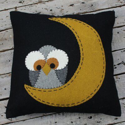 an owl is sitting on the moon pillow