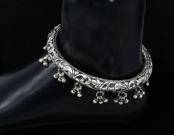 Amazing handcrafted chitai or kandrai work 925 sterling silver vintage design custom made oxidized silver foot kada , ankle bracelet personalized unisex gifting jewelry from india. Metal-925 sterling silver. Item type-Ankle Kada. Weight-68.890 grams for single bnagle. Size-8 cm (3.14 inches inner diameter)We can easily wear this bangle by twisting it. Width-1.1 centimeters(2.5 with hanging drops) stamped- 925. Finish-Oxidized. Quantity-Single piece. Makes excellent gifting for birthday, mother's Festive Oxidized Bangle, Handmade Silver Metal Anklets, Sterling Silver Toe Ring Anklet For Festivals, Traditional Oxidized Bangle, Traditional Silver Anklets For Festive Occasions, Traditional Metal Anklets For Gift, Traditional Metal Anklets As Gift, Silver Temple Jewelry Anklets As Gift, Festive Silver Anklets With Oxidized Finish