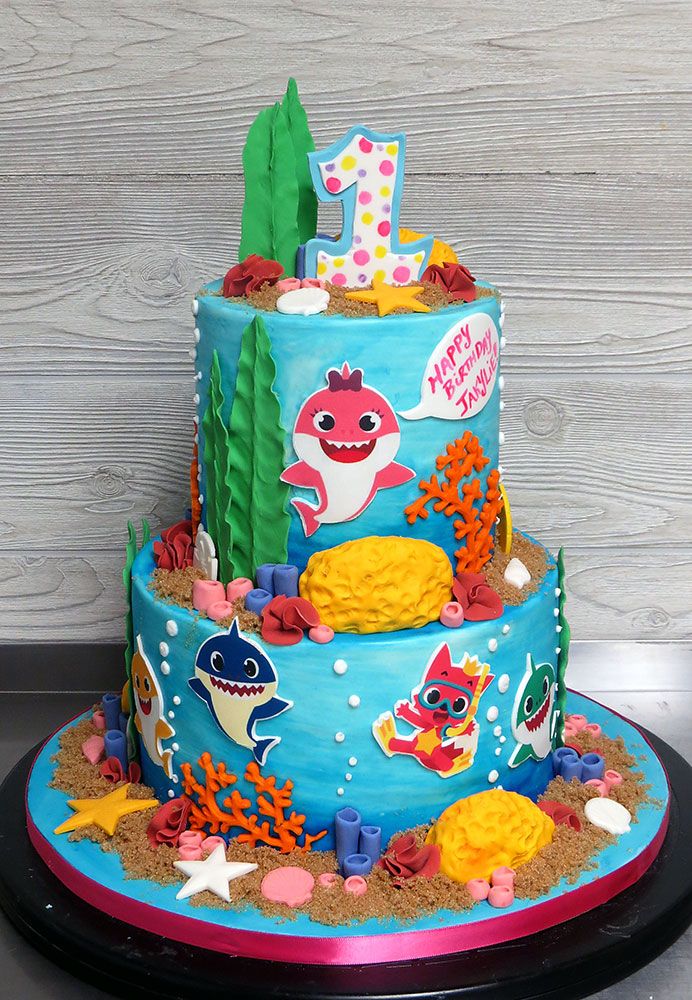 a birthday cake decorated with an ocean theme