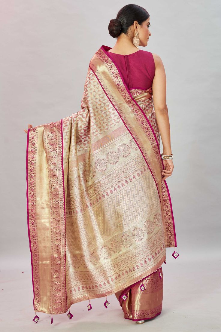 Look royal at weddings and special occasions in this golden pink heavy kanchipuram saree. It comes with a blouse piece. Disclaimer: The shown stitched blouse on the model is for display purpose only. The saree comes with a matching blouse piece and finished with fall and piko. Festive Pink Jamawar Blouse Piece, Gold Anarkali Banarasi Silk Blouse Piece, Gold Semi-stitched Blouse Piece With Pallu, Gold Art Silk Choli With Self Design, Festive Gold Banarasi Silk Choli, Pink Jamawar Blouse Piece For Festivals, Semi-stitched Gold Blouse Piece With Pallu, Gold Banarasi Silk Blouse Piece For Diwali, Pink Jamawar Blouse Piece For Diwali