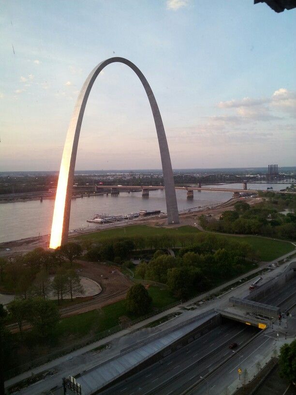 an aerial view of the st louis arch at sunset