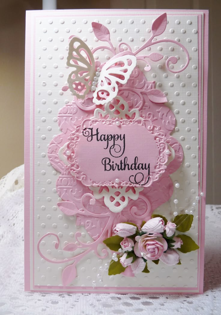 a birthday card with pink flowers and butterflies