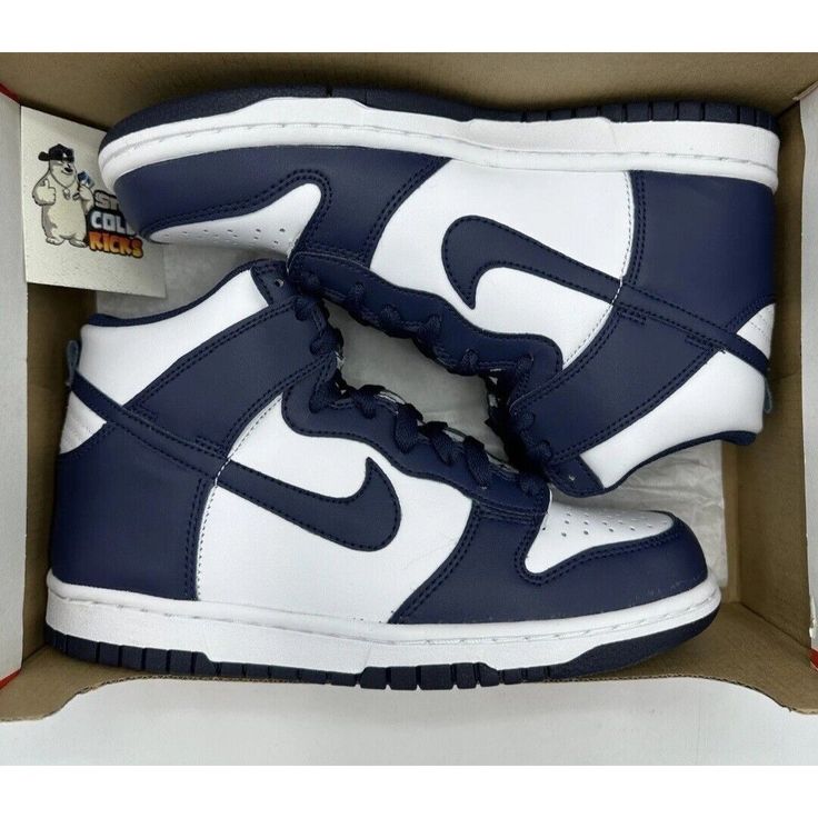 Elevate Your Sneaker Game With These Stylish Nike Dunk High Sneakers. Available In Kid's Size 4y And Women's Size 5.5, This Sneaker Is Perfect For Both Young And Mature Sneaker Enthusiasts. The White And Navy Colorway Adds A Touch Of Sophistication, While The High-Top Shoe Shaft Style Provides Ample Support. Crafted With Quality Materials, This Nike Dunk High Belongs To The Nike Dunk Product Line, Known For Its Durability And Comfort. With Its Style Code Db2179-104, This Athletic Sneaker Is Perf Nike Sporty High-top Sneakers With Round Toe, Casual Navy Low-top Basketball Shoes, Nike Navy Custom Sporty Sneakers, Navy High-top Basketball Shoes With Rubber Sole, High-top Navy Basketball Shoes With Rubber Sole, Navy Cushioned Basketball Shoes For Streetwear, Navy High-top Skate Shoes With Rubber Sole, Navy High-top Skate Shoes For Sports, Navy Nike Casual Sneakers