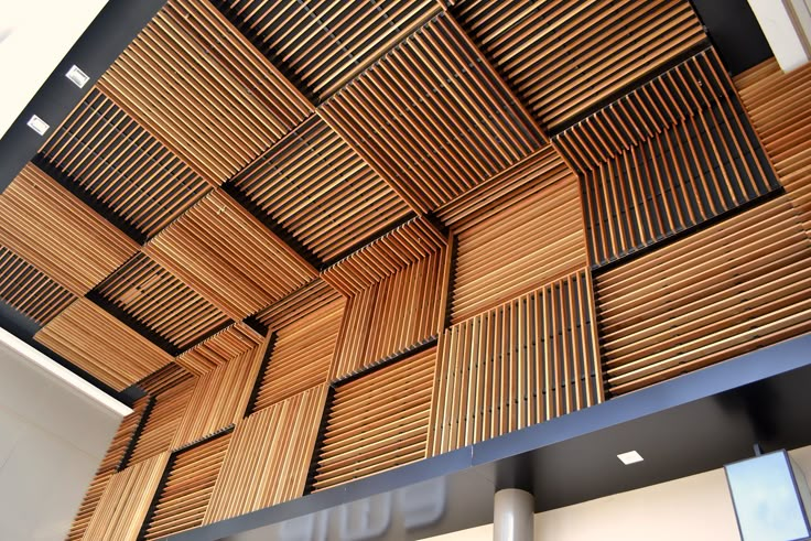 the ceiling is made out of wood and has many different types of patterns on it