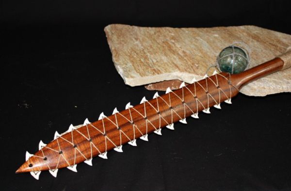 a wooden object with spikes on it