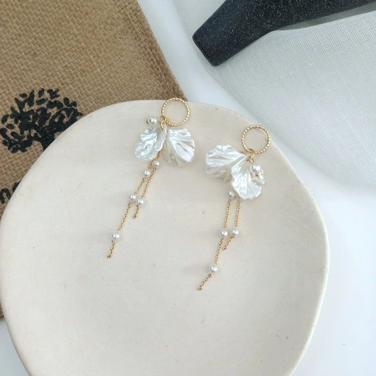 Check out our bow shaped pearl tassel earrings. Such an elegant pair of earrings, that would be perfect for just the right outfit. Elegant Pearl Drop Tassel Earrings, Elegant Pearl Drop Tassel Earrings For Party, White Chic Dangle Chandelier Earrings, Elegant Formal Tassel Drop Earrings, Elegant Dangle Tassel Earrings For Pierced Ears, Elegant Tassel Dangle Earrings For Pierced Ears, Chic White Dangle Bridal Earrings, Elegant Pearl Drop Dangle Tassel Earrings, Elegant Pearl Drop Tassel Earrings For Wedding