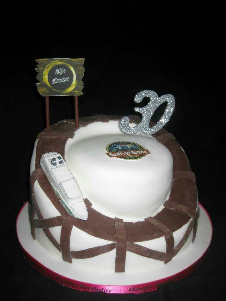 a birthday cake with the number 30 on it and a remote control sitting on top