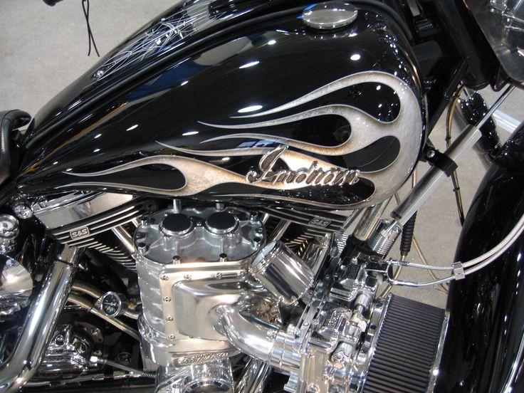 the front end of a black and chrome motorcycle