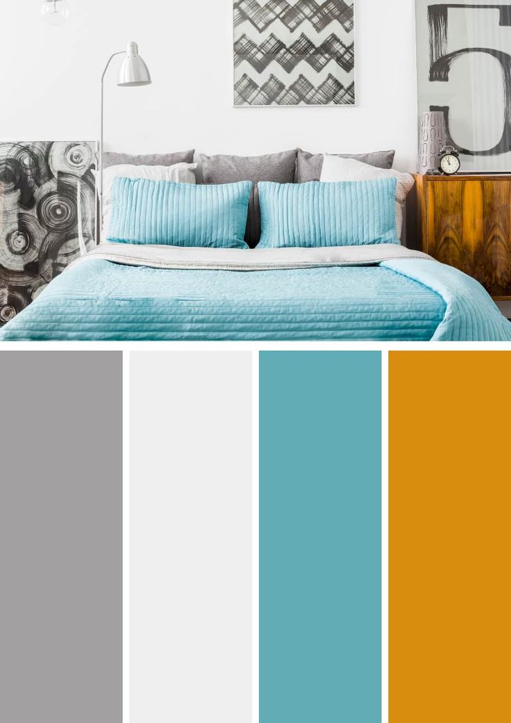 a bedroom with blue and orange colors in the bed, nightstands and paintings on the wall