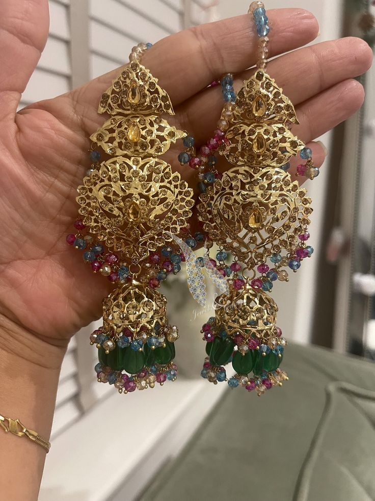 Add a touch of elegance to your ensemble with these stunning Traditional Indian / Pakistani Jewelry Jhumki Earrings. Handcrafted with precision and care, these exquisite earrings feature intricate designs that reflect the rich cultural heritage of India and pakistan. The jhumki style adds a traditional and timeless charm to any outfit, making them perfect for special occasions or everyday wear. Make a statement with these beautiful earrings that showcase the beauty and craftsmanship of Pakistani jewelry artistry. 22k Gold Dangle Jhumkas For Festive Occasions, 22k Gold Chandbali Jhumkas For Festive Occasions, Traditional 22k Gold Bridal Earrings For Festive Occasions, 22k Gold Jhumkas For Weddings And Festivals, 22k Gold Dangle Jhumkas For Wedding, 22k Gold Jhumkas With Latkans For Wedding, Wedding 22k Gold Jhumkas With Latkans, 22k Gold Chandelier Earrings For Weddings And Festivals, 22k Gold Meenakari Earrings For Navratri