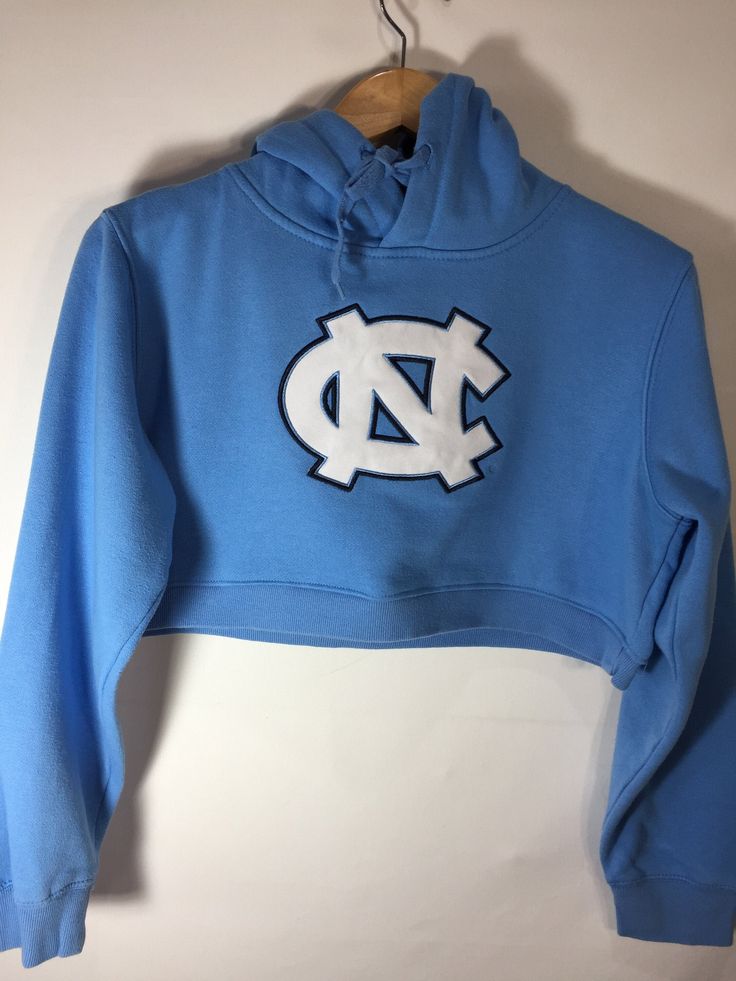 North Carolina Cropped Hoodie Winter Sportswear Hoodie For Fan Gear, Casual Sports Hoodie Top, Hooded College Sweatshirt With Double-lined Hood, College Hooded Sweatshirt With Double-lined Hood, Collegiate Hoodie For Winter Sports, Collegiate Sports Hoodie For Winter, Collegiate Winter Sports Hoodie, Double-lined Hooded Sweatshirt For College, Cotton Hoodie For Fan Gear