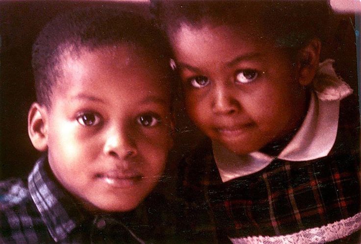 two young children are posing for the camera