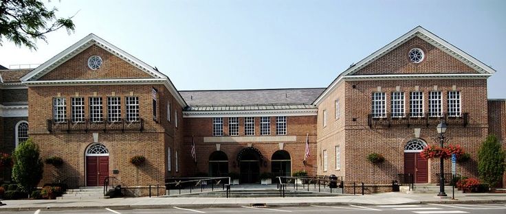 the national baseball hall of fame sign is displayed in front of an old brick building