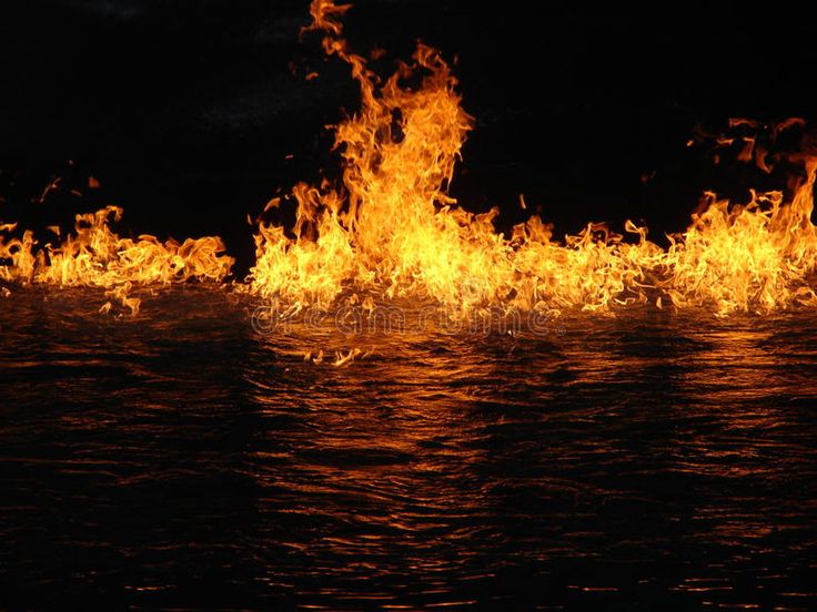 the fire is burning over the water at night stock images and royalty photos are being used to create this image