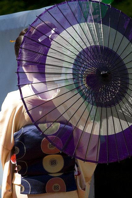 a woman holding an umbrella in her hand