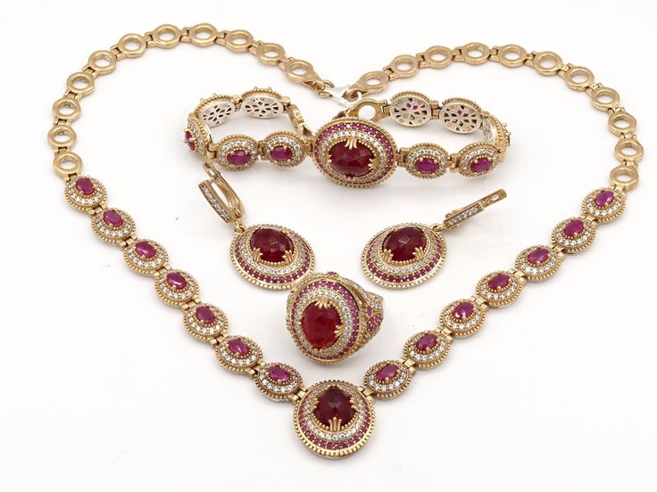 WELCOME TO SUSANJEWELYGIFTS *Introducing our exquisite Turkish design jewelry set, inspired by the captivating charm of the Ottoman era. This complete set consists of earrings, rings, necklaces and bracelets, carefully handcrafted with a fusion of silver and bronze metals. The oval cut design beautifully showcases the splendor of radiant red ruby stones, adding a touch of elegance and sophistication to every piece. Elevate your style with this remarkable jewelry set that pays homage to the rich Luxury Jewelry Sets With Round Jewels, Luxury Round Jewels Jewelry Sets, Luxury Red Ruby Jewelry, Luxury Hand Set Ruby Jewelry Sets, Luxury Ruby Jewelry Gift, Luxury Round Ruby Jewelry, White Gold Ruby Jewelry, Luxury Ruby Jewelry, Luxury Red Jewelry For Gift