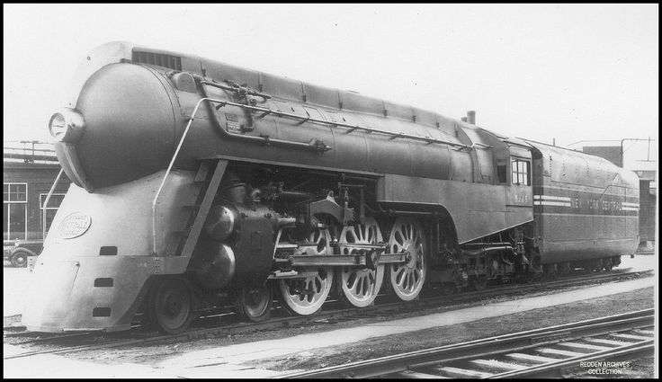 an old train engine sitting on the tracks